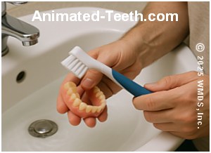 A picture showing denture brushing over a half-filled sink.